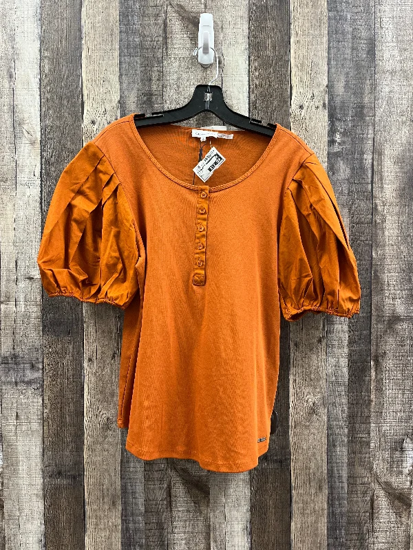 women's tops for those who want to wear versatile pieces that can be dressed up or downTop Short Sleeve By Calvin Klein In Orange, Size: L